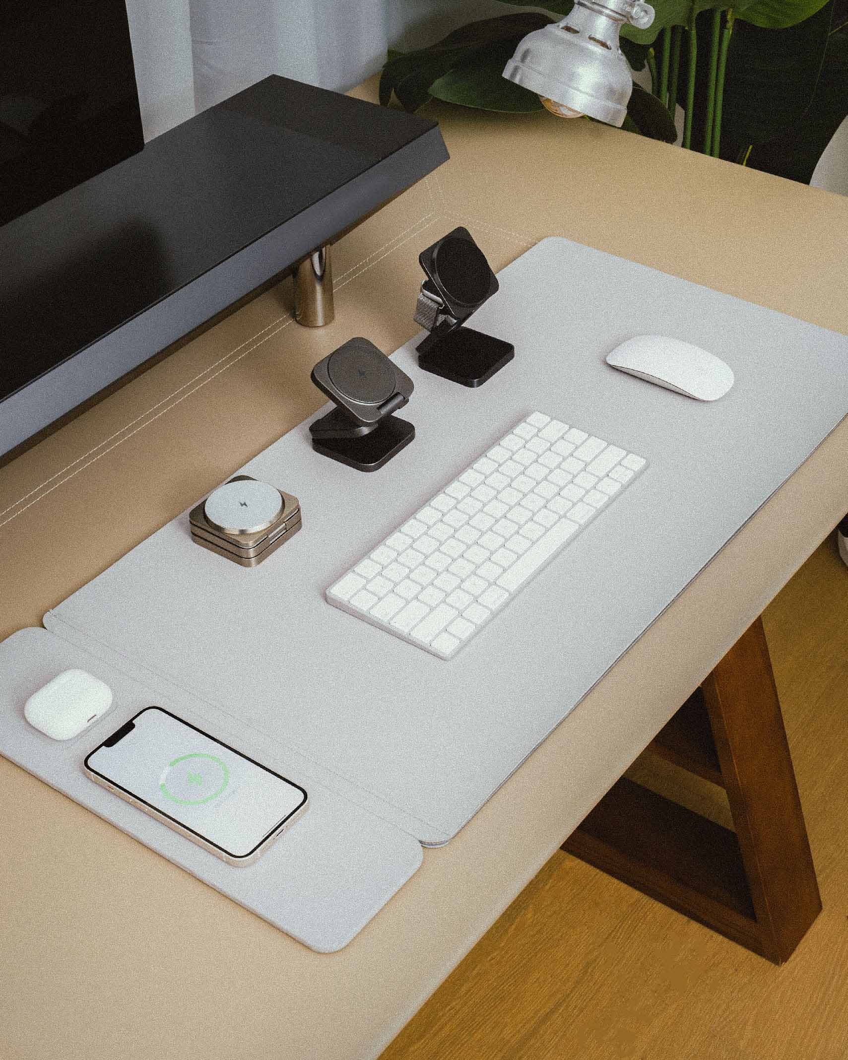 NeoDesk collection featuring Leather Dual-Layer Wireless Charging Desk Mat, Ultra Portable 3-in-1 Wireless Charger, and accessories displayed in a modern workspace setup, highlighting functionality and sleek design.