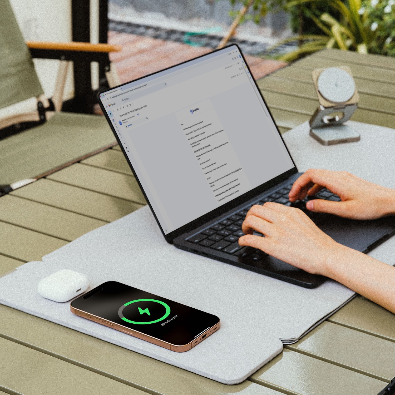 NeoDesk wireless charging desk mat in a professional office setting with a sleek black design, keyboard, and seamless charging.